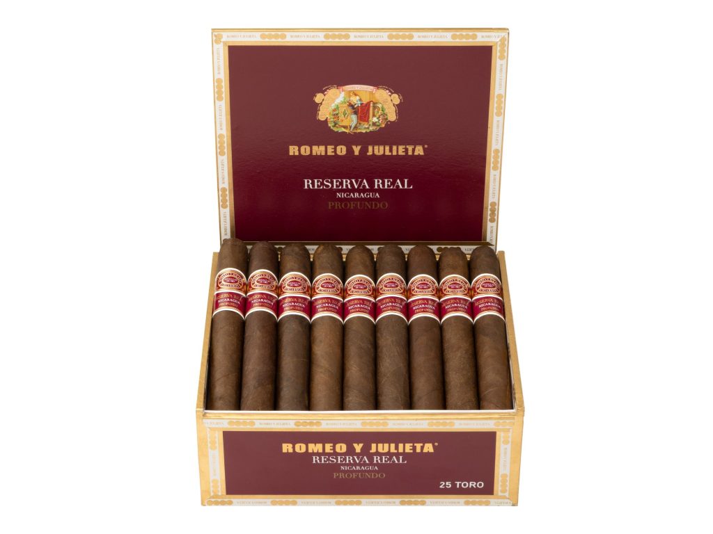 Open Romeo y Julieta Reserva Real Nicaragua Profundo cigar box displaying rows of Toro cigars with red and gold bands on a white background.